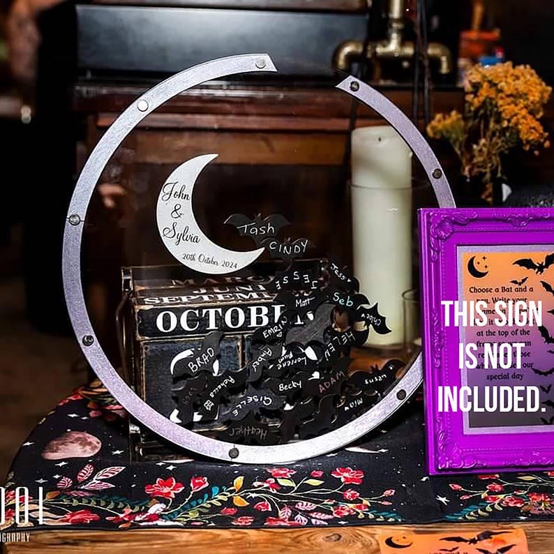 Acrylic Halloween guest book with bat-shaped pieces – a gothic wedding keepsake.