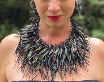 Unique, bold black statement necklace with a bit of gold, red and green colours, recycled bicycle inner tube, rubber necklace by Laura Zabo