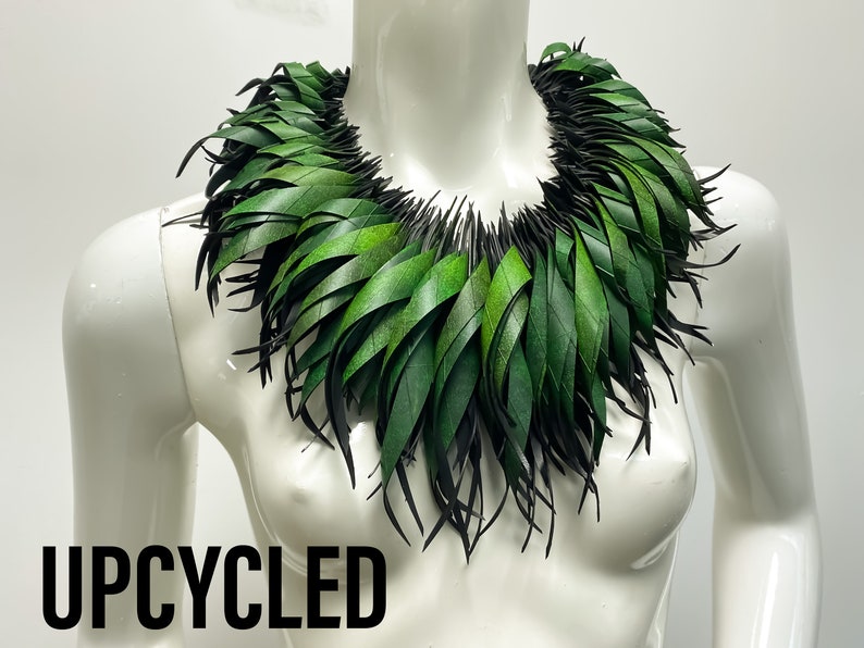 Green statement necklace, upcycled bicycle inner tube jewelry on a white mannequin