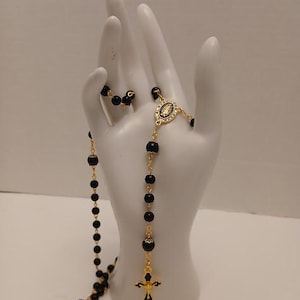Traditional 5 Decade Rosary made with black glass beads & gold and enamel Cross and Mother Mary Centerpiece surrounded by rhinestones!