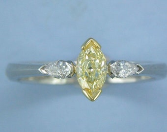 Marquise cut yellow diamond ring with two pear cut white diamonds by John R Fox