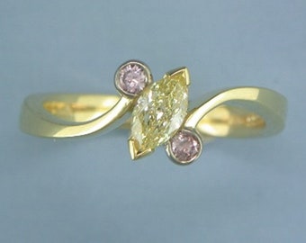 Yellow diamond ring with two pink  diamonds by John R Fox