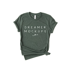 May include: A dark green t-shirt with rolled up sleeves and a white text design that says "DREAMER MOCKUPS".