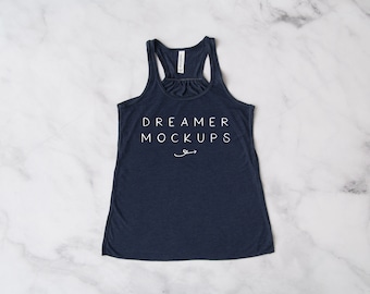 May include: A navy blue tank top with the text "DREAMER MOCKUPS" printed in white on the front.