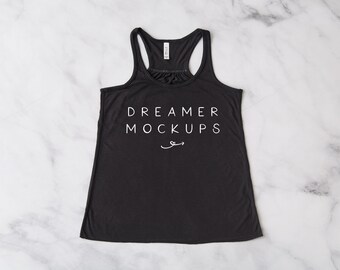 May include: A black racerback tank top with the text "DREAMER MOCKUPS" printed in white on the front.