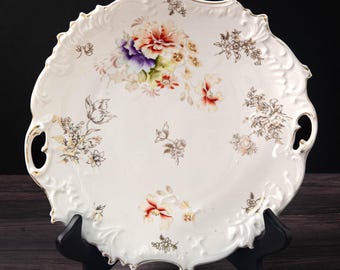 Antique Hand Painted nine and a half inch porcelain plate with Carnations