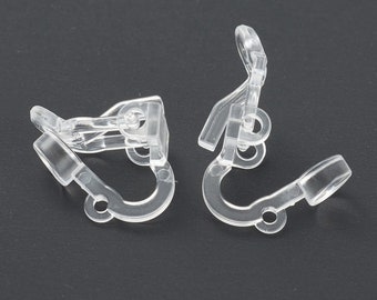 May include: Two clear plastic earring backs. The backs are designed to hold earrings in place and are made of a clear, durable plastic.