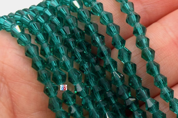Chapelet de 118 perles en verre à facettes toupie 4mm ab vert