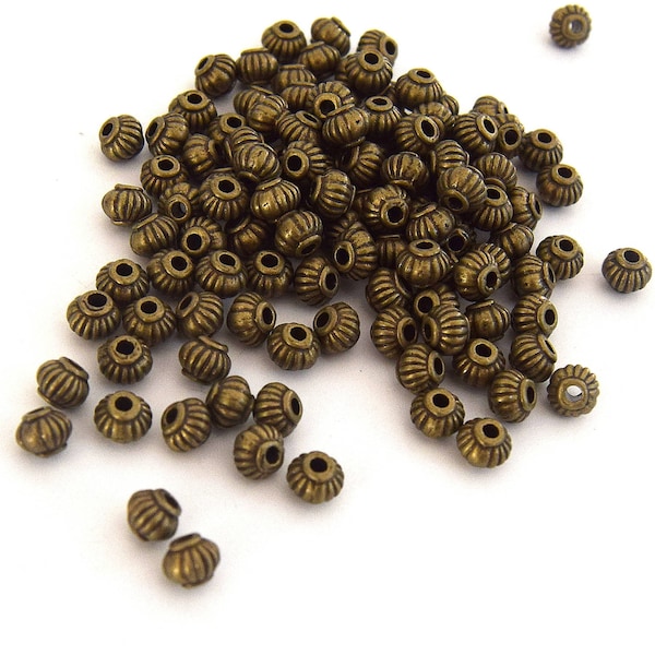 Perles citrouille Intercalaires antique bronze  5x4mm  Par lots de  20/50 unités