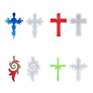 May include: A collection of eight cross-shaped pendants in various colors and designs. Includes blue, red, green, and clear resin crosses, along with cross-shaped molds. Ideal for crafting or religious-themed projects.