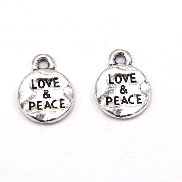 Round flat Tibetan pendant with the word love and peace. Pack of 20/50 units