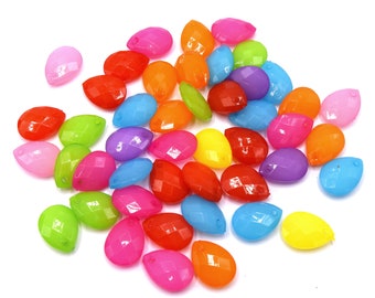 May include: A collection of colorful teardrop-shaped beads, featuring a variety of bright hues including pink, orange, yellow, green, blue, and purple.