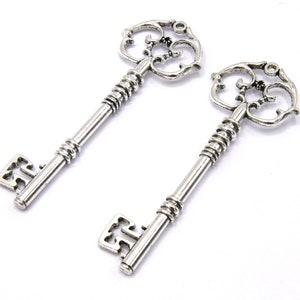 Set of 4 large silver metal key pendants