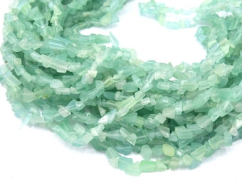 1 string of light green cat's eye glass beads