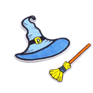 May include: A blue witch's hat with a black belt and a yellow buckle, and a yellow and orange broom.