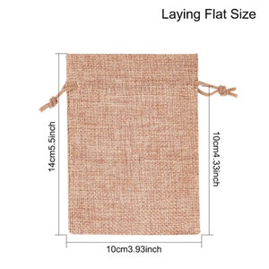 May include: A brown burlap drawstring bag with a 5.5 inch by 4.33 inch laying flat size. The bag is made of natural burlap fabric and has a drawstring closure.