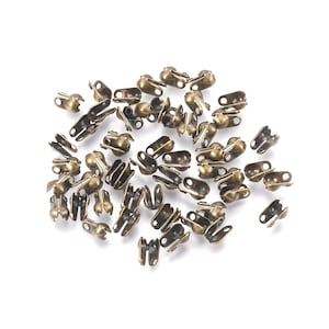 Bronze 6x3.5mm folding clasp end caps for knot covers - 150 units