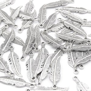 Shiny Silver Feather Charms 27x6mm Lot of 20/50 units B02 image 1