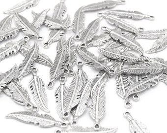 Shiny silver feather charms 27x6mm Pack of 20/50 units B02