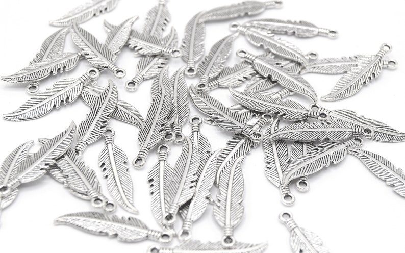 Shiny Silver Feather Charms 27x6mm Lot of 20/50 units B02 image 1