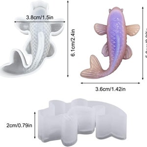 K&ouml;nnte beinhalten: Zwei Silikonformen zum Herstellen von Fisch aus Harz. Eine Form ist eine einzelne Fischform, die andere ist eine Form f&uuml;r zwei kleinere Fische. Die Formen sind wei&szlig; und messen 15,5 cm x 9,7 cm und 5 cm x 9,1 cm.