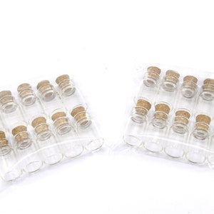 May include: Two packages of clear glass bottles with cork stoppers. Each package contains 12 bottles.