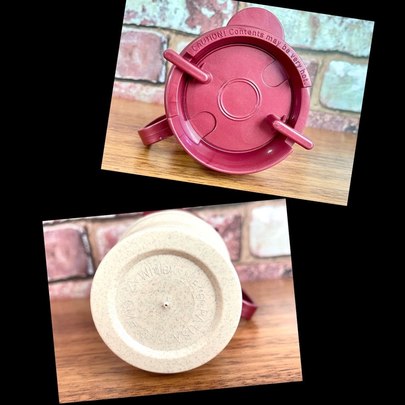 May include: A close-up of a beige travel mug with a brown lid. The lid has a warning label that reads "CAUTION! Contents may be very hot".