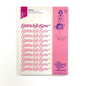 May include: A vintage sewing pattern for a blazer, featuring the text "Stretch & Sew" in pink. The pattern includes sizes 28-40 and is designed for knit fabrics. The cover has a pink and white color scheme.