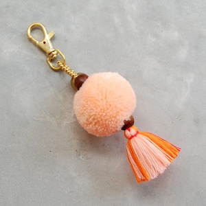 Light Orange Pom Pom Tassel Bag Accessory with Brass Bell image 1