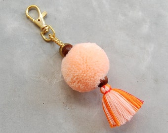 Light Orange Pom Pom Tassel Bag Accessory with Brass Bell