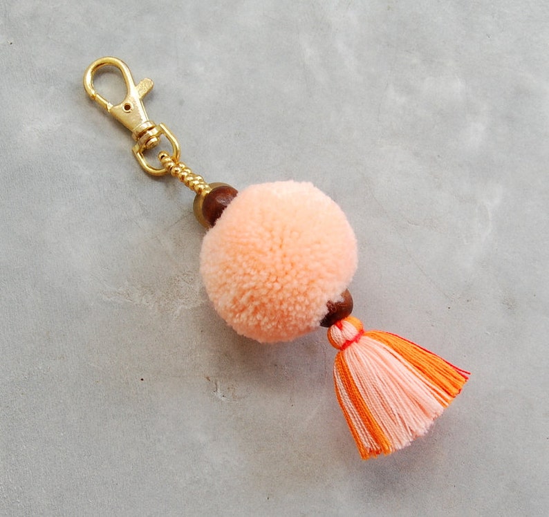 Light Orange Pom Pom Tassel Bag Accessory with Brass Bell image 1