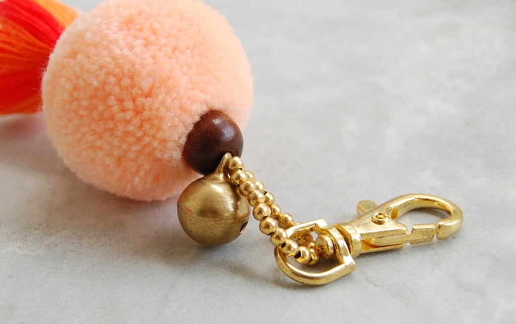 Appendino Decorativo A Pompon Arancione Con Elefanti E Campanella - Rastogi Handicrafts