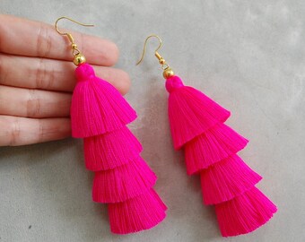 Hot pink yet slightly purplish .Bronze top stylish tassel earrings