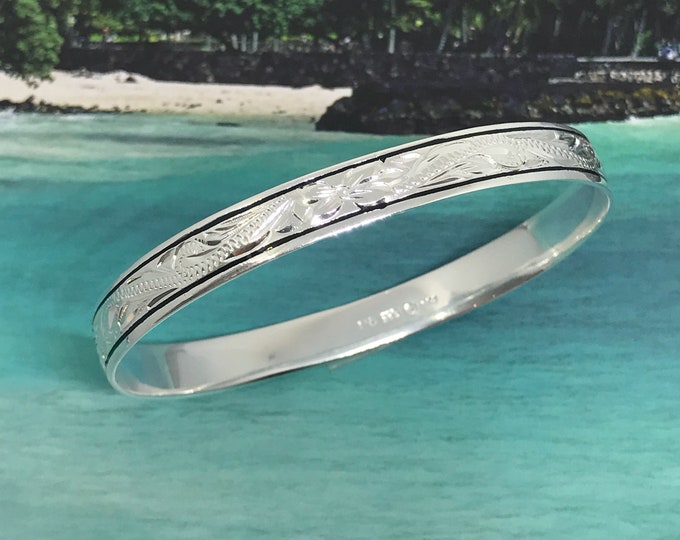 Featured listing image: Sterling Silver 8mm Hawaiian Plumeria Design with Black Border Bangle (B239-8mm)
