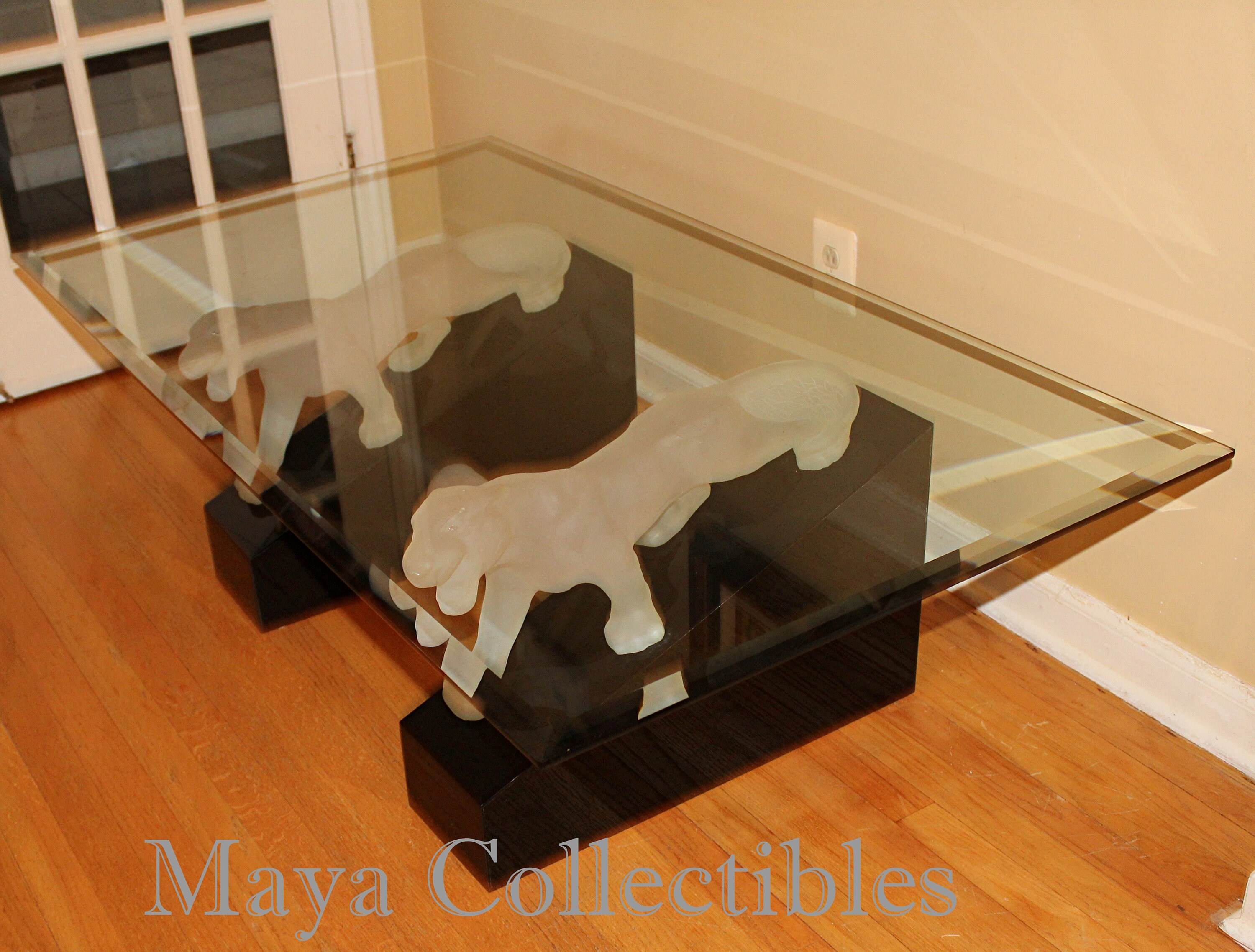 Panther coffee table with glass top deals
