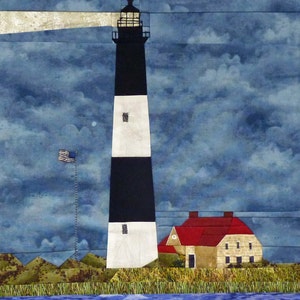 May include: A black and white striped lighthouse with a red roofed house in front of it. The lighthouse is on a grassy hill with a body of water in the foreground. The sky is a cloudy blue.