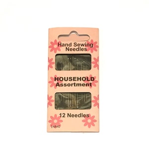May include: A pink and white package of 12 hand sewing needles. The package says "Hand Sewing Needles" and "Household Assortment".