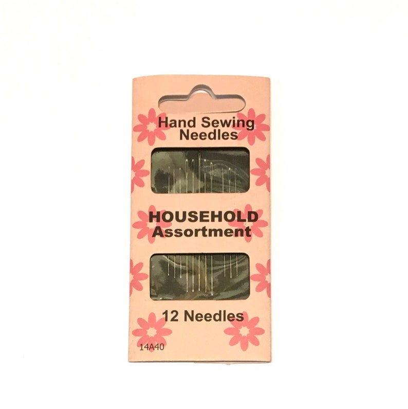 May include: A pink and white package of 12 hand sewing needles. The package says "Hand Sewing Needles" and "Household Assortment".