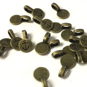 CIONDOLO TONDO BAILS COLLA SU 18mm X 10mm ARGENTO TIBETANO