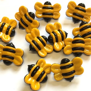 10, 25mm black and yellow bee shaped buttons with a rear shank, bumble bee buttons