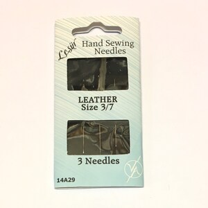 May include: A package of 3 leather sewing needles, size 3/7, from the Leshif brand. The package is blue and white with the text "Hand Sewing Needles" and "Leather Size 3/7".