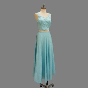 May include: A white ceramic mug with a black handle and the text "But First, Coffee" in a black, bold font. The mug is on a white surface.