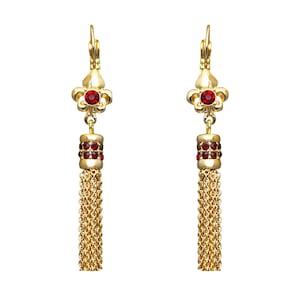 May include: Gold tassel earrings with red crystal accents. The earrings feature a fleur-de-lis design.