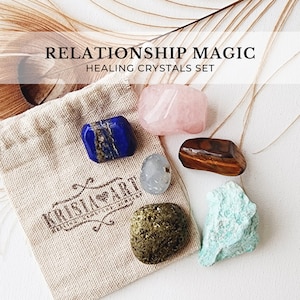May include: A set of six healing crystals in a small burlap bag. The crystals are rose quartz, lapis lazuli, clear quartz, tiger's eye, aventurine, and green aventurine. The bag has the text "Kristal Art" printed on it. The crystals are for relationship magic.