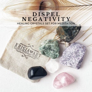 May include: Set of six healing crystals in a small cloth bag. The crystals are black, green, white, pink, and purple. The bag has a label that says "Krisia Art". The text on the image reads "Dispel Negativity Healing Crystals Set for Meditation".