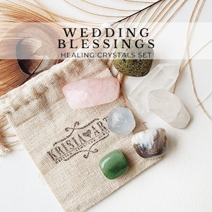 May include: A set of six healing crystals in a small burlap bag. The crystals are rose quartz, clear quartz, green aventurine, clear calcite, agate, and amethyst. The crystals are arranged in a circle around the bag. The bag has the text "KristalArt" printed on it.