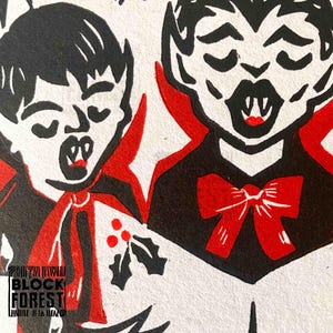 May include: Black and red illustration of two vampire figures with closed eyes and open mouths, featuring sharp fangs. One figure has a red bow tie, the other has a red cape. The image has a vintage, woodcut style.