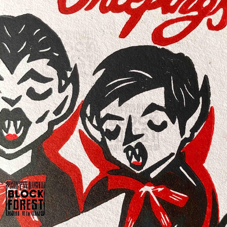 May include: A black and red illustration of two cartoon vampires with fangs, wearing red capes and bow ties. The word "cheepys" is written in red at the top. The Block Forest logo is in the bottom left corner.