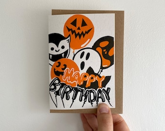 Spooky Birthday Balloons Linocut Card. Handmade Cute and Funny Greetings Card for Halloween and Spooky Friends.
