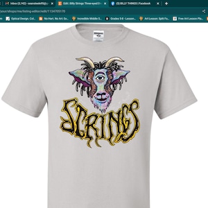 May include: A white t-shirt with a colorful illustration of a goat with one eye and the word "SPRINGS" in yellow and black lettering.